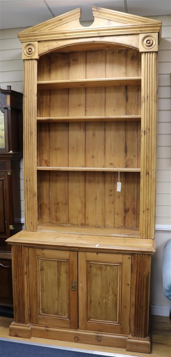 A near pair of classical style pine open bookcases, W.3ft 2.5in. D.1ft 10in. H.8ft 7in.